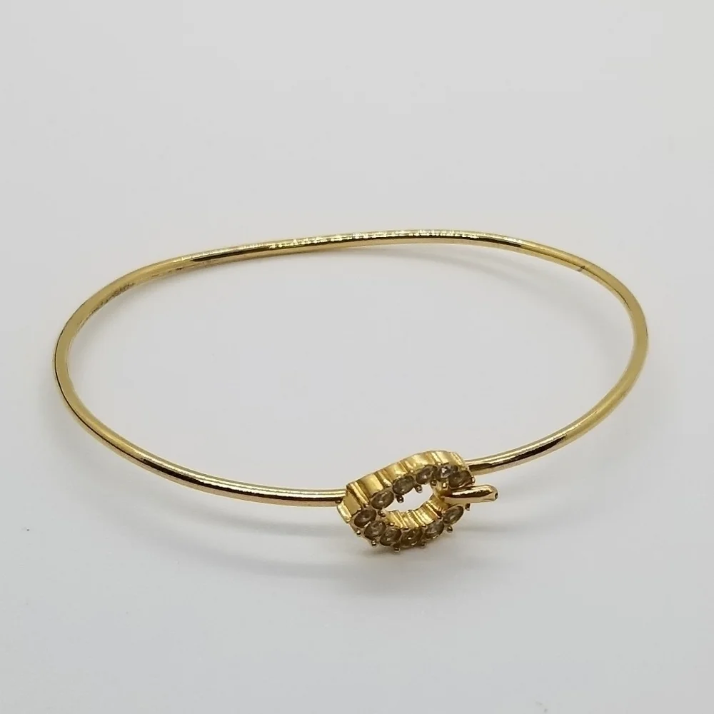 gold tone bracelet with pave rhinestone teardrop clasp